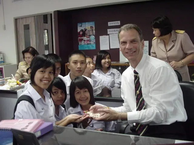 Otto F. Gatternigg with students in a school office